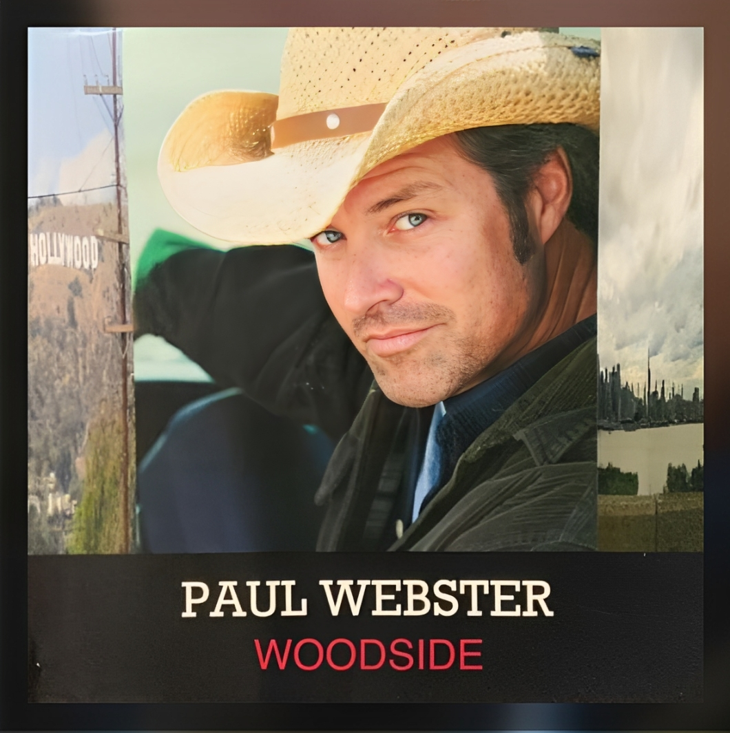 A man wearing a cowboy hat and jacket.